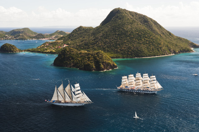 Sailboats ocean island mountain tiltshift free wallpaper for desktop - medium preview image