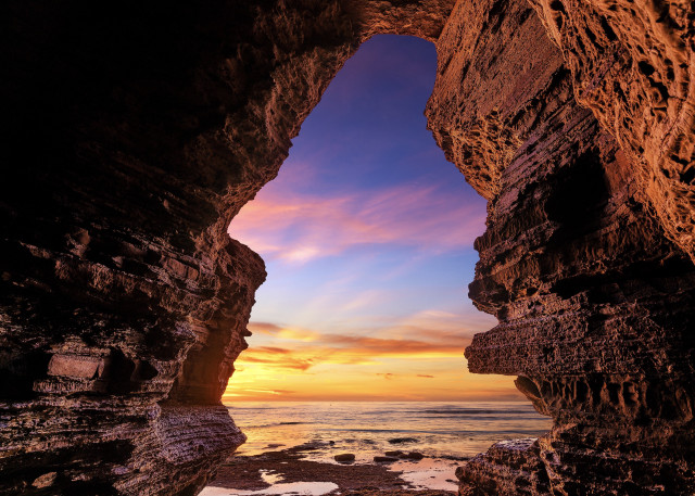 Sunset cave beach ocean rocky free wallpaper for desktop - medium preview image