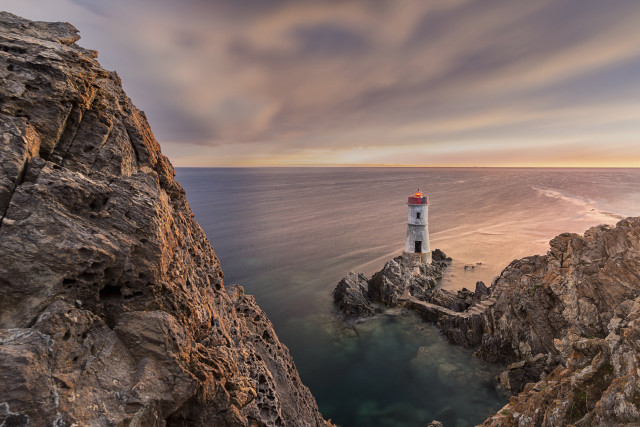 Lighthouse rocky cliff ocean sunset #5 free wallpaper for desktop - medium preview image