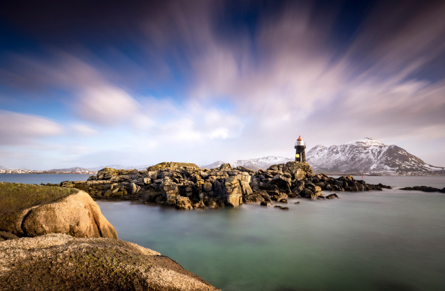 Lighthouse rocky shore mountain cloudy free wallpaper for desktop - medium preview image