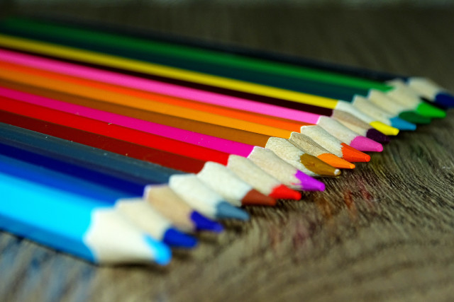 Colored pencils wooden surface blurry free wallpaper for desktop - medium preview image