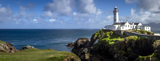 Lighthouse cliff ocean clouds grassy free wallpaper for desktop - medium preview image