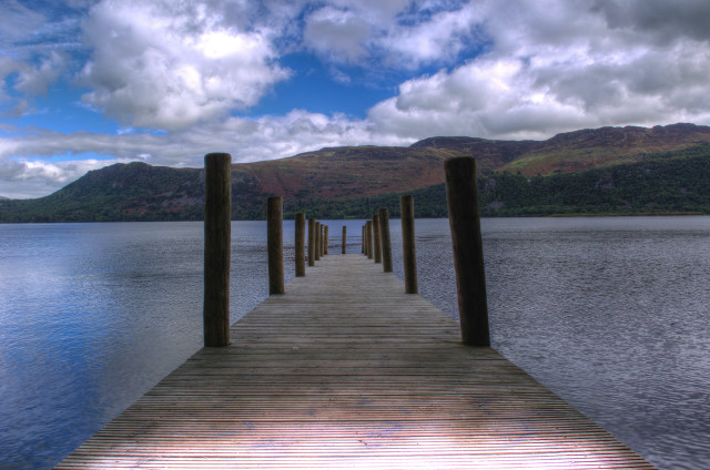 Lake dock poles mountains sky free wallpaper for desktop - medium preview image