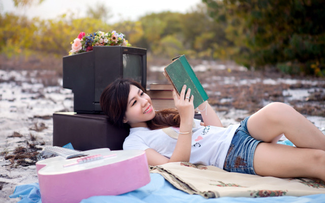 Woman lying beach book flower free wallpaper for desktop - medium preview image
