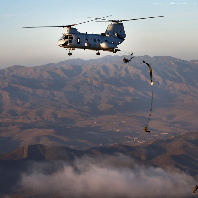Helicopter mountain parachute man dangling free wallpaper for tablet - medium preview image