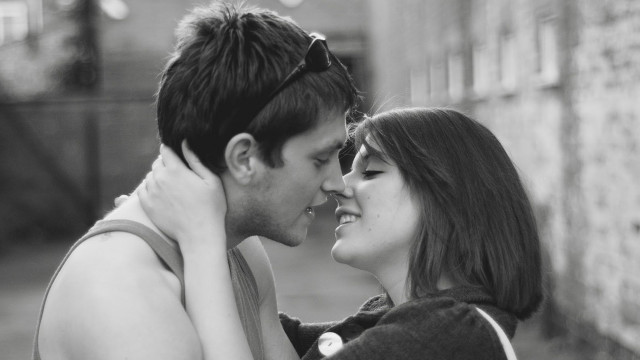 Man woman cuddling together street free wallpaper for desktop - medium preview image