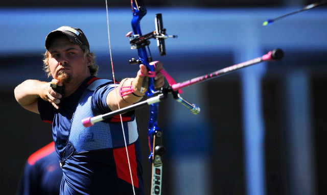 Man holding bow aiming arrow free wallpaper for desktop - medium preview image