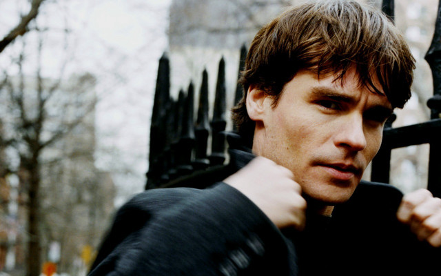 Man black fence serious look free wallpaper for desktop - medium preview image