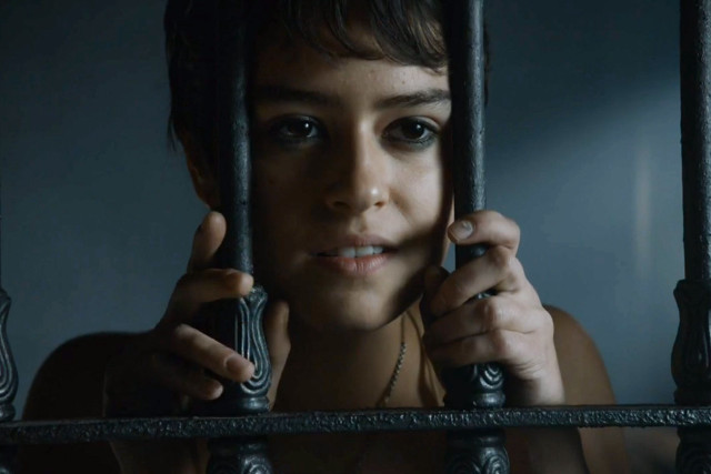 Woman behind bars serious look free wallpaper for desktop - medium preview image