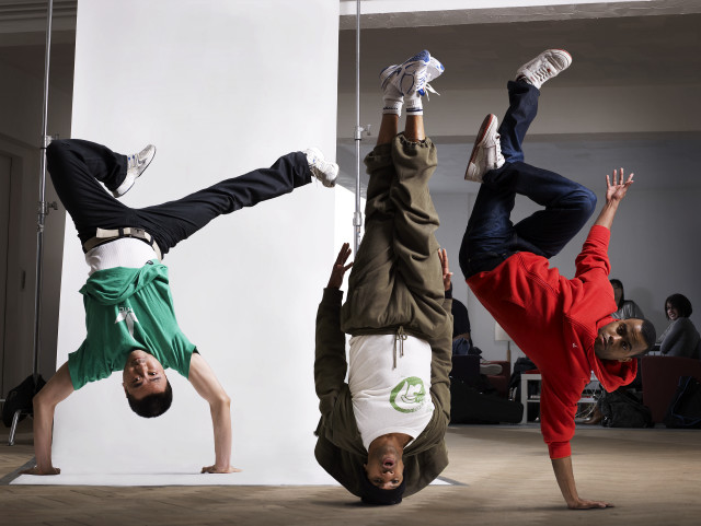 Three boys handstand white wall free wallpaper for desktop - medium preview image