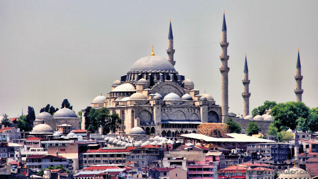 Large building spires city rooftops free wallpaper for desktop - medium preview image