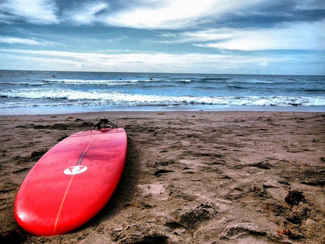 Red surfboard beach waves cloudy free wallpaper for desktop - medium preview image