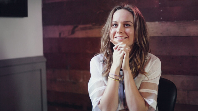 Woman smiling table hands folded free wallpaper for desktop - medium preview image