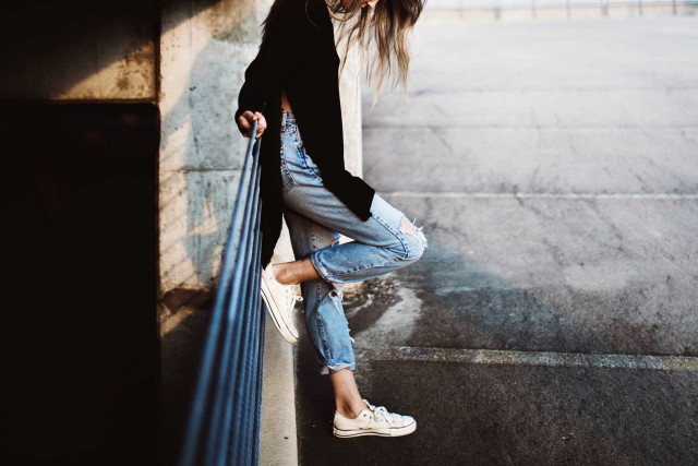 Woman leaning wall hands hips #2 free wallpaper for desktop - medium preview image