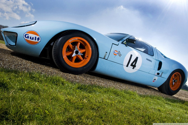 Blue racecar orange wheels dirtroad free wallpaper for desktop - medium preview image