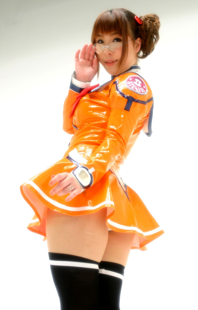 Woman orange outfit posing hands free wallpaper for mobile - medium preview image