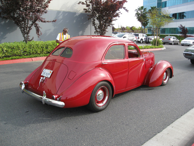 Red car parked road building #3 free wallpaper for desktop - medium preview image