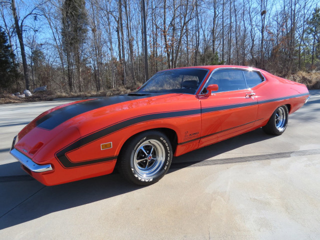 Red car parking lot forest free wallpaper for desktop - medium preview image