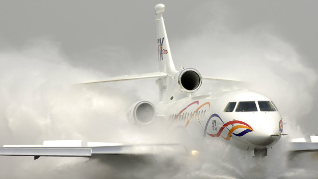 Jetliner cloudy sky runway smoke free wallpaper for desktop - medium preview image