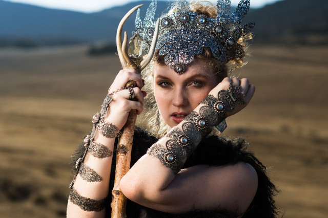 Woman horned headdress holding stick free wallpaper for desktop - medium preview image