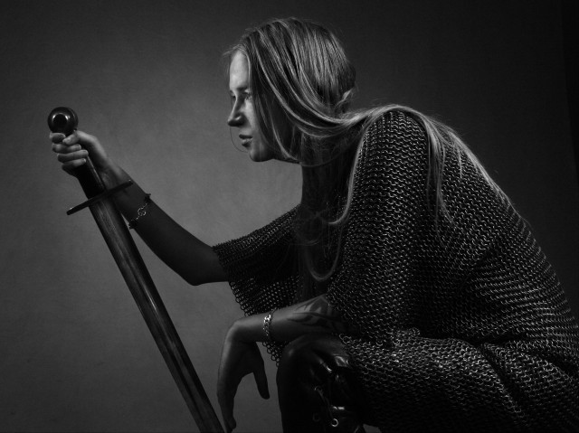 Woman holding sword serious expression free wallpaper for desktop - medium preview image