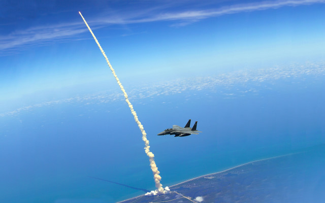 Jet rocket flying ocean sky free wallpaper for desktop - medium preview image