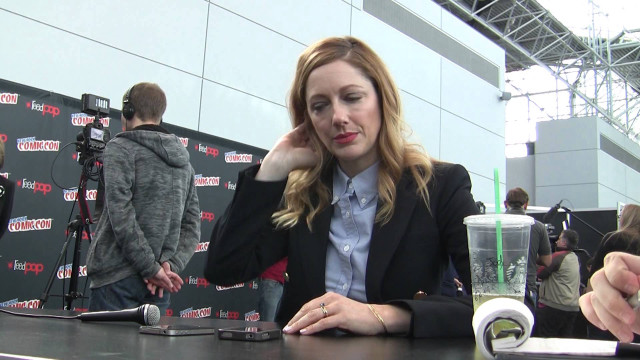 Woman sitting table drink camera free wallpaper for desktop - medium preview image