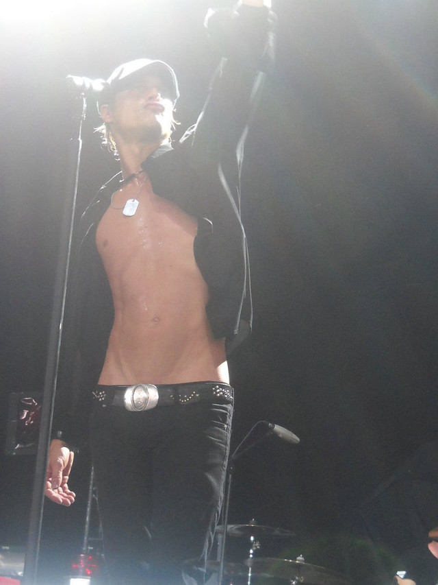 Shirtless man microphone stage band free wallpaper for mobile - medium preview image