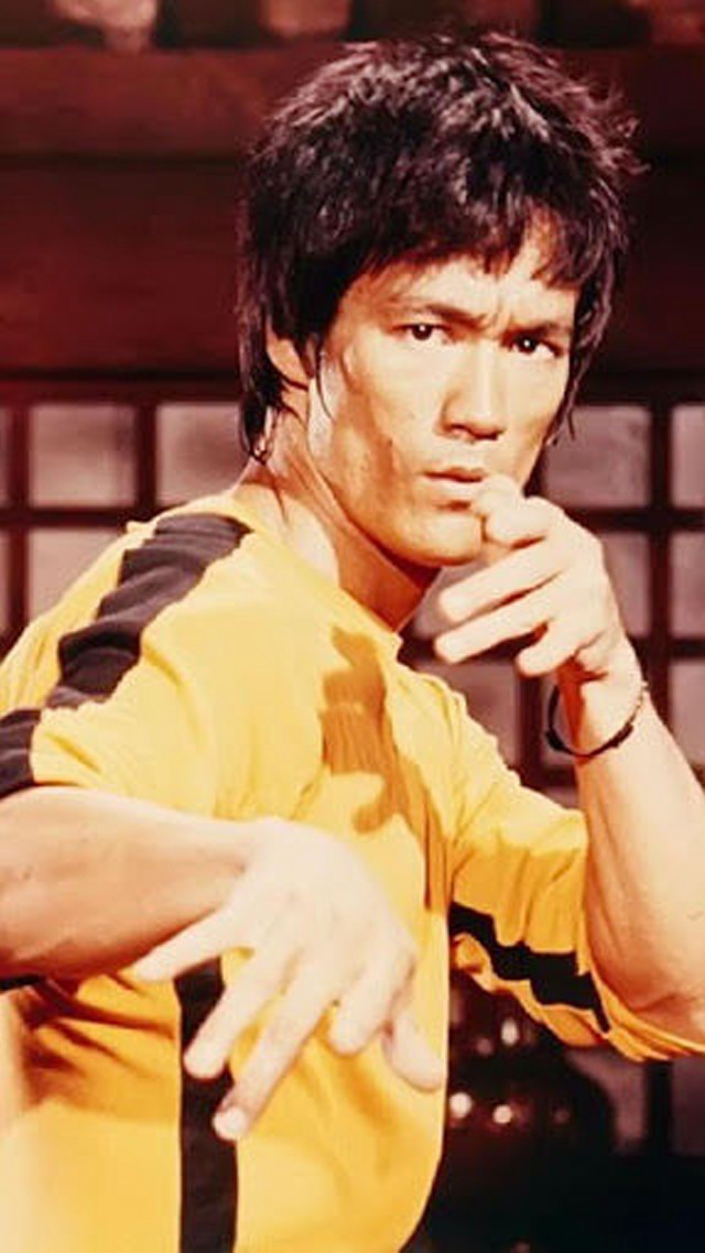 Man yellow shirt serious hand free wallpaper for mobile - medium preview image