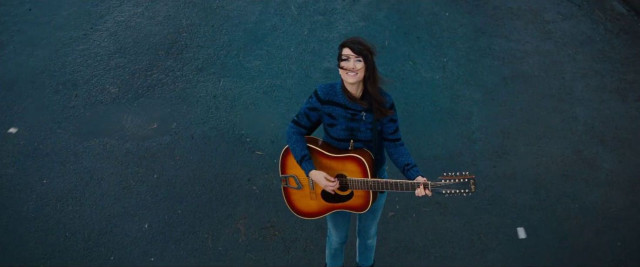 Woman holding guitar blue black free wallpaper for desktop - medium preview image