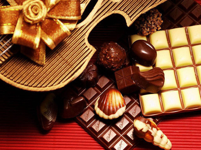 Chocolates candybars redtablecloth bow stilllife free wallpaper for desktop - medium preview image