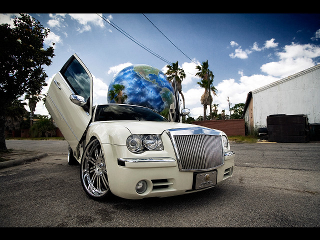 White car globe hood parked free wallpaper for desktop - medium preview image