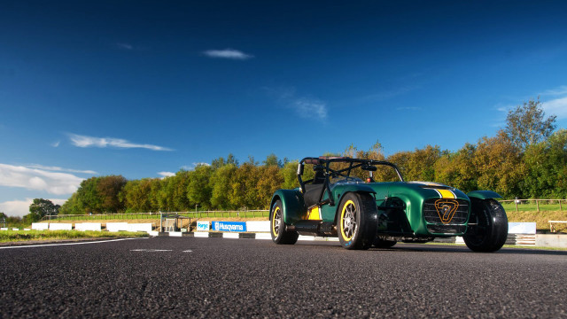 Green yellow car driving road free wallpaper for desktop - medium preview image