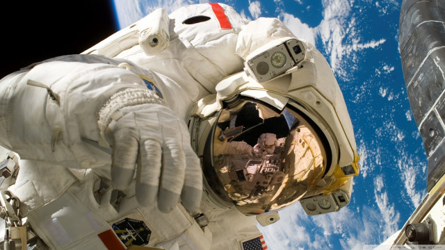 Man spacesuit space station earth free wallpaper for desktop - medium preview image