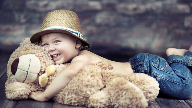 Boy smiling teddy bear straw free wallpaper for desktop - medium preview image