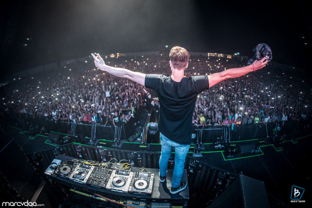 Man stage arms outstretched crowd free wallpaper for desktop - medium preview image