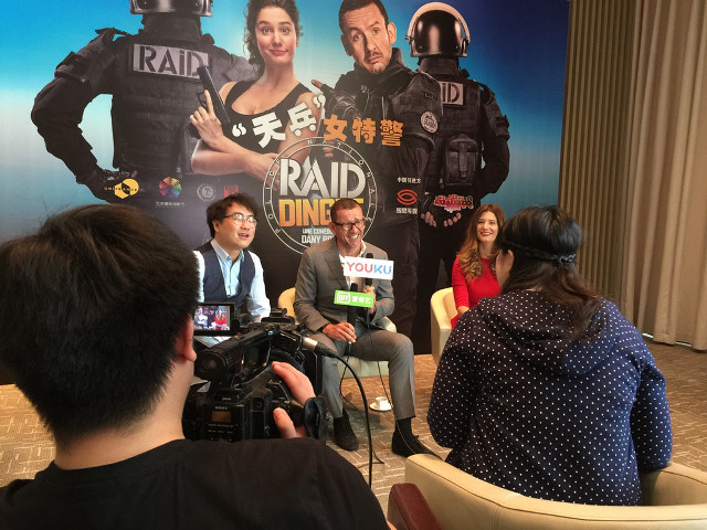 Group people table camera poster free wallpaper for desktop - medium preview image