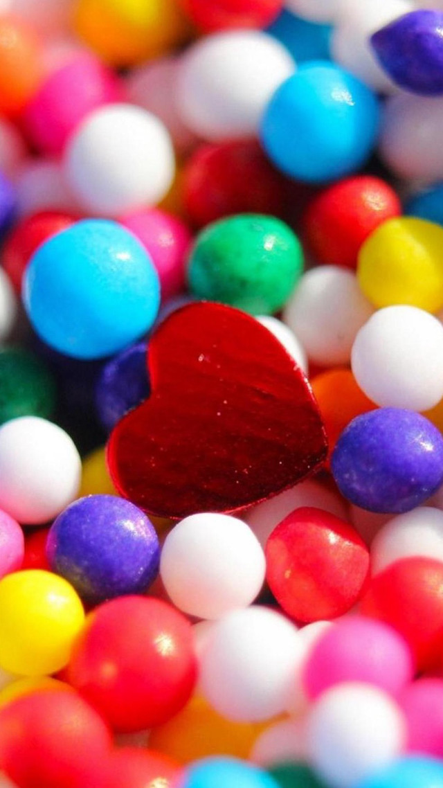 Heart candy closeup bokeh shiny free wallpaper for mobile - medium preview image