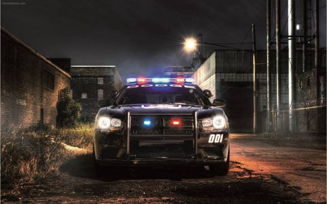 Police car dirt road night free wallpaper for desktop - medium preview image