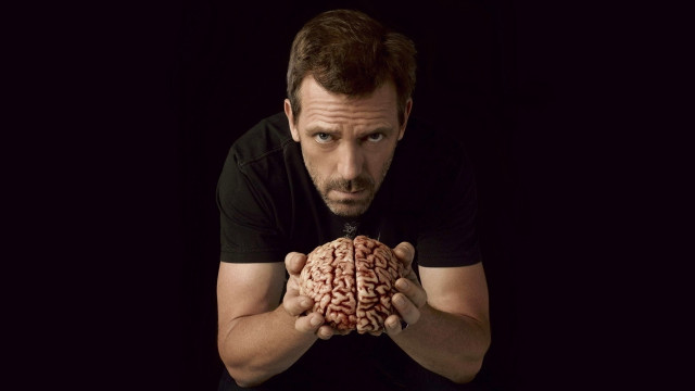 Man holding brain black background #3 free wallpaper for desktop - medium preview image