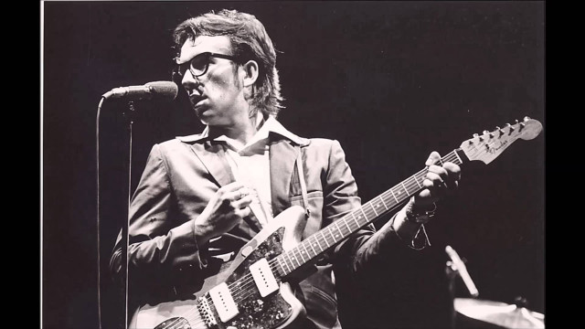 Man playing guitar microphone stand #4 free wallpaper for desktop - medium preview image