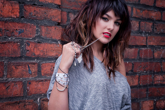 Woman necklace bracelet brick wall free wallpaper for desktop - medium preview image