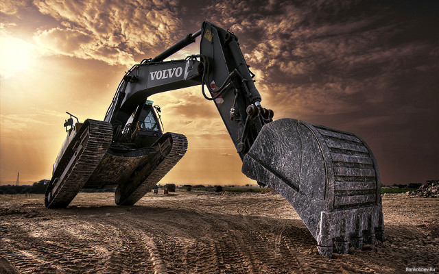 Bulldozer digging dirt road cloudy free wallpaper for desktop - medium preview image