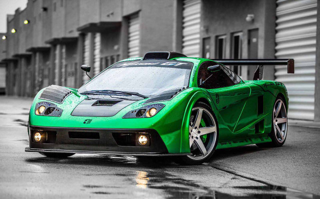 Green sports car parked street free wallpaper for desktop - medium preview image