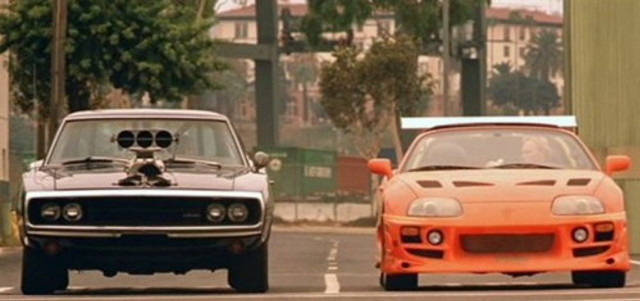 Two cars driving street building free wallpaper for desktop - medium preview image