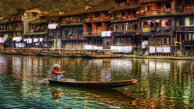 Person boat water buildings river free wallpaper for desktop - medium preview image