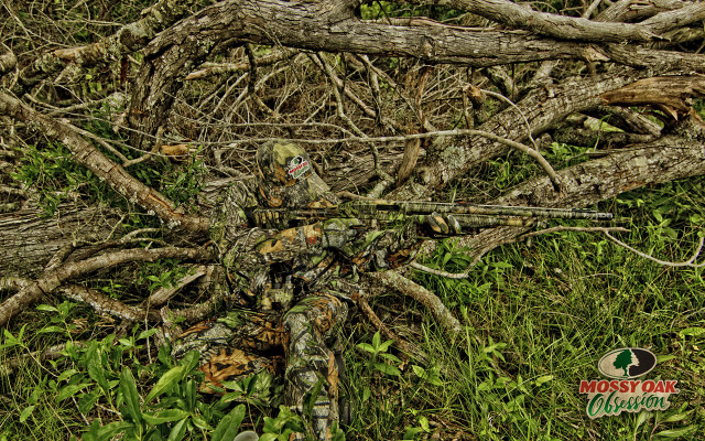 Camouflaged man laying grass gun free wallpaper for desktop - medium preview image