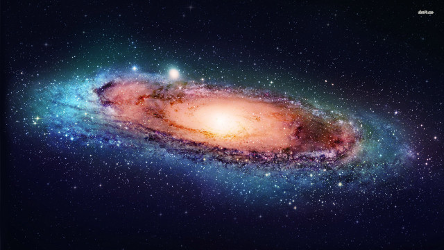 Large galaxy bright orange center free wallpaper for desktop - medium preview image