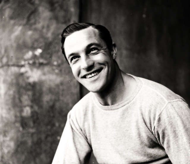 Smiling man sitting clock wall free wallpaper for desktop - medium preview image