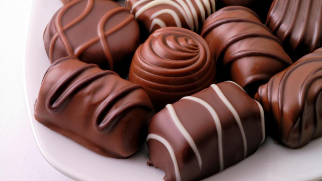 Plate of chocolates with white free wallpaper for desktop - medium preview image
